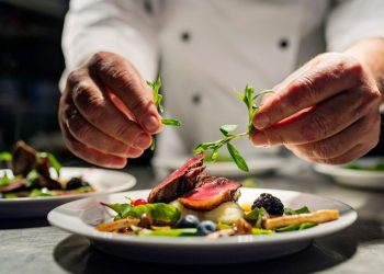 Man plating a fine-dining meal