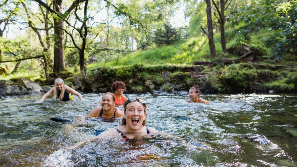 Women wild swimming in the lake district
